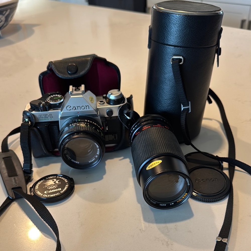 Canon AE-1 Black and Silver Camera with Lenses